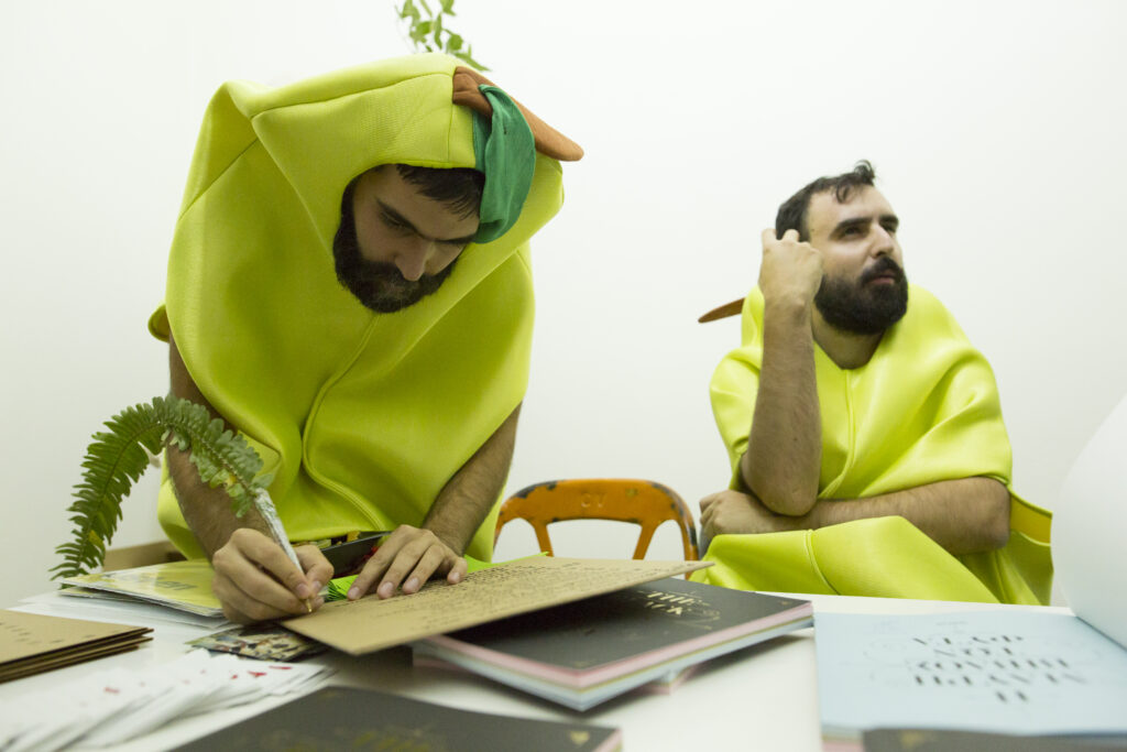 Picture of FYTA - an Athens-based conceptual art and performance art duo - dressed as bananas